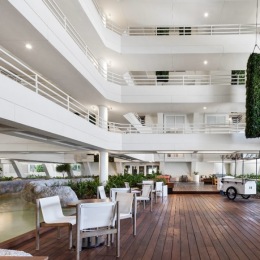 a spacious room with tables and a water fountain