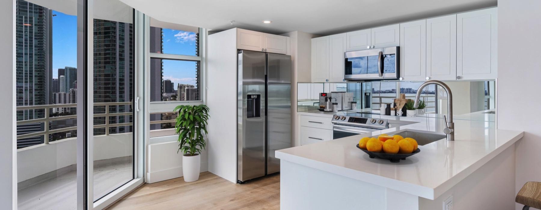 a kitchen with white cabinets