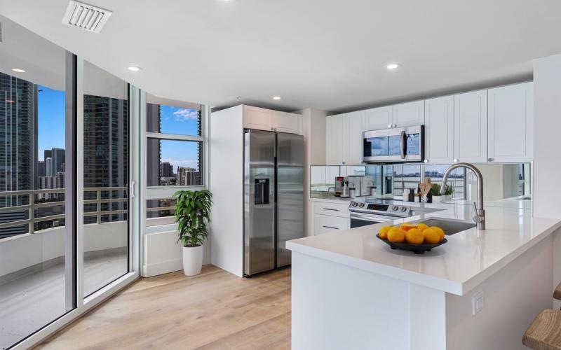 a kitchen with white cabinets