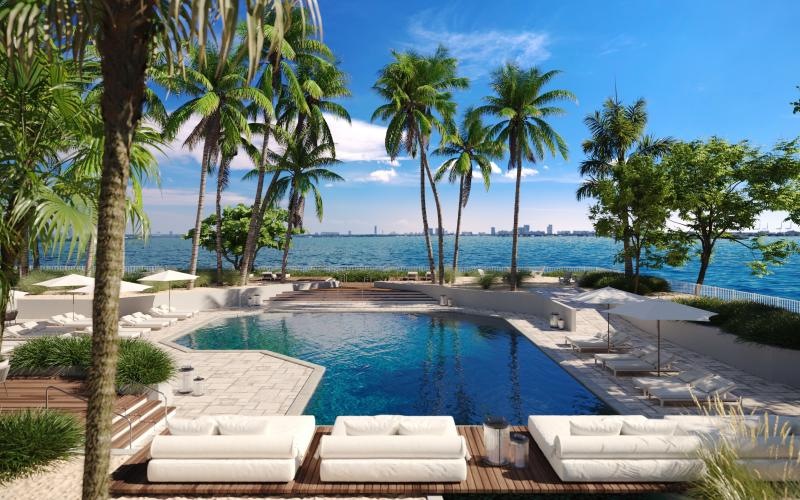 a pool with lounge chairs around it